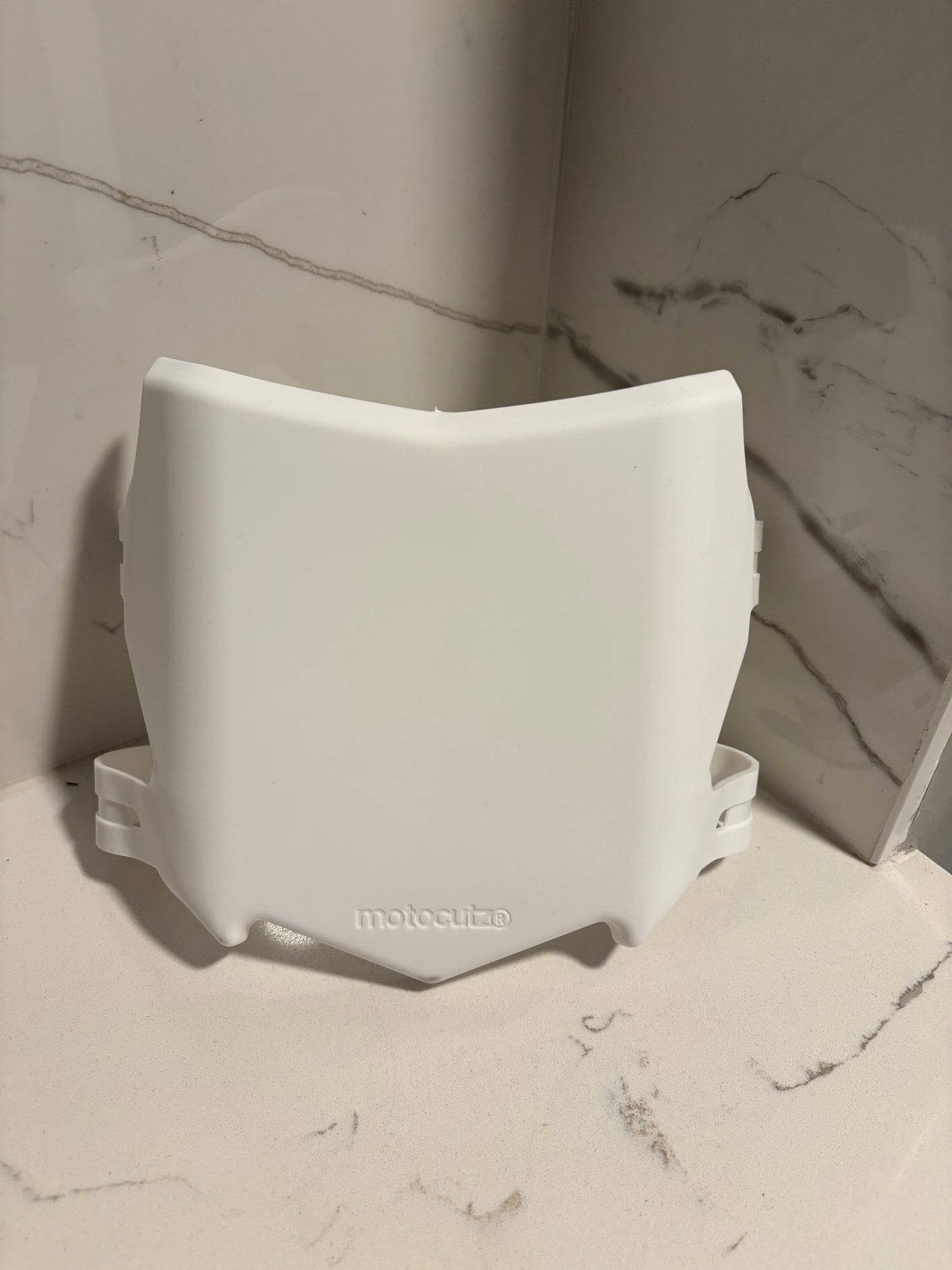 White Motocutz number plate